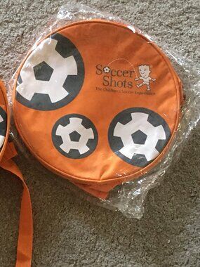2 Orange Soccer Shots backpacks for kids